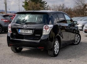 Black Opel Meriva compact MPV parked in a lot, rear three-quarter view showing side profile and hatchback design