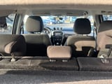 Interior view of a compact car with seats folded down and cargo area visible