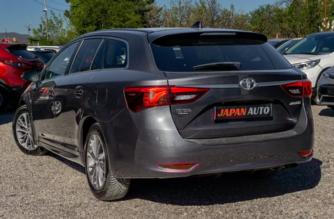Gray Toyota Auris station wagon parked in a lot with Japan Auto license plate visible on the back