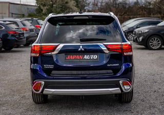 Blue Mitsubishi Outlander with Japan Auto branding