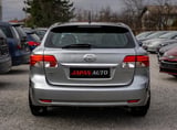 Silver Toyota Matrix hatchback viewed from the rear at a used car dealership lot with other vehicles in the background