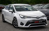 White Toyota sedan side view