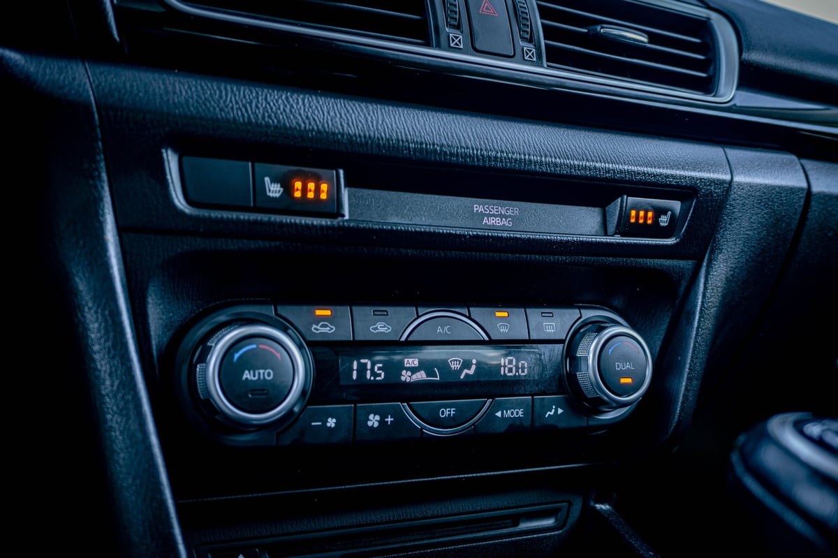 Car climate control and HVAC system with dual temperature settings and digital display showing 17.5 and 18.0 degrees