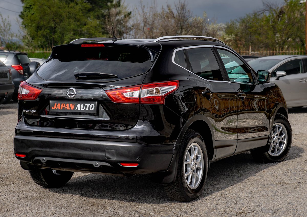 Black Nissan Qashqai SUV parked in a lot with Japan Auto license plate visible