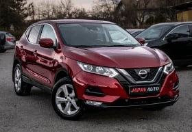 Red Nissan Qashqai SUV