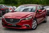 Red Mazda sedan front view